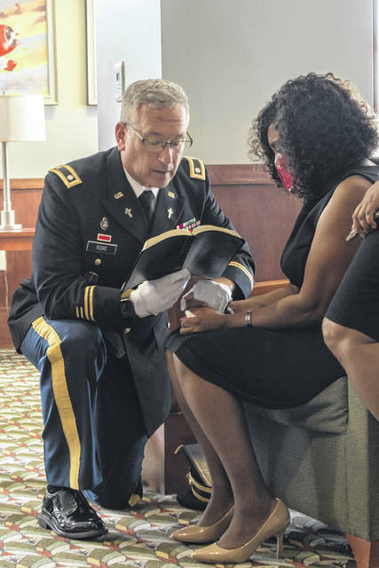 U.S. Army Chaplain (Lt. Col.) Charles Poore, South Carolina National Guard chaplain, prays with the mother of U.S. Army 1st Lt. Trevarius Bowman before his remains returned to Spartanburg. The South Carolina National Guard Honor Guard conducted a dignified transfer of U.S. Army 1st Lt. Trevarius Bowman, 198th Signal Battalion, Company B, returning his remains to his family in Spartanburg. Bowman died of non-combat related injuries May 19, 2020, while deployed to Afghanistan.
U.S. Army National Guard photo by Staff Sgt. Jerry Boffen, South Carolina National Guard