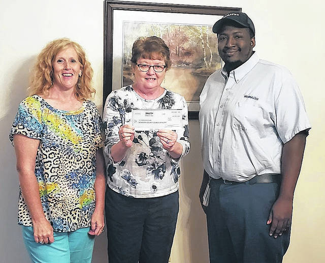 Representatives from Komatsus Newberry plant give a $1,000 donation to Newberry County Council on Aging, part of the Komatsu Feeding America campaign. Pictured, left to right, Shannon Longshore, Lynn Stockman, Oscar Jenkins.
Courtesy of Komatsu