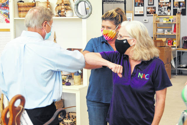 Senator Lindsey Graham greeting Marquerite Palmer and Sharon Graham at the Newberry Arts Center.
                                 Andrew Wigger | The Newberry Observer