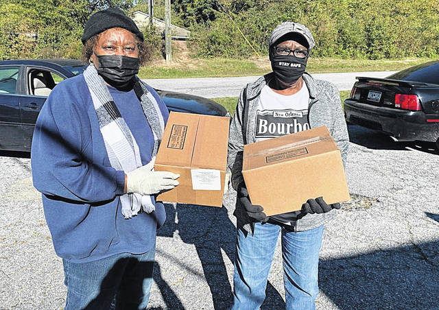 126166744_web1_thumbnail_IMG_2263
Lillie Bates and Earnestine Ratliff volunteer with the Living Hope Foundation to distribute food to those in need in Newberry County.
Courtesy photo