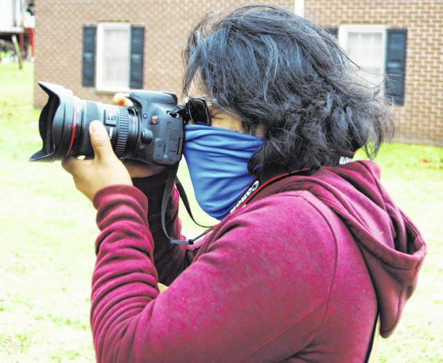 126389398_web1_DSC_0046
Oswaldo Tapia takes some shots during a photo walk in the West End.
Andrew Wigger | The Newberry Observer