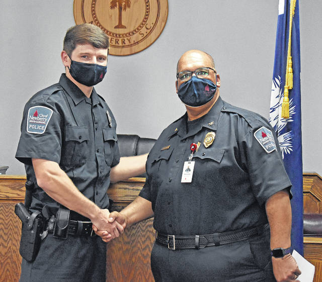 <p>Patrolman Clayton McConnell (left) was sworn in by Police Chief Roy McClurkin (right) and has officially joined the City of Newberry Police Department.</p>
<p>Elyssa Haven for The Newberry Observer</p>