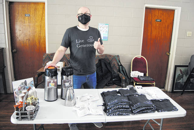 Robert Kopp provided coffee, t-shirts and other goodies to the volunteers at the Living Hope Foundation.
                                 Andrew Wigger | The Newberry Observer