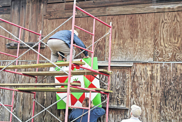 <p>The new quilt patch is being placed on Rita Boozer’s family barn.</p>
                                 <p>Andrew Wigger | The Newberry Observer</p>