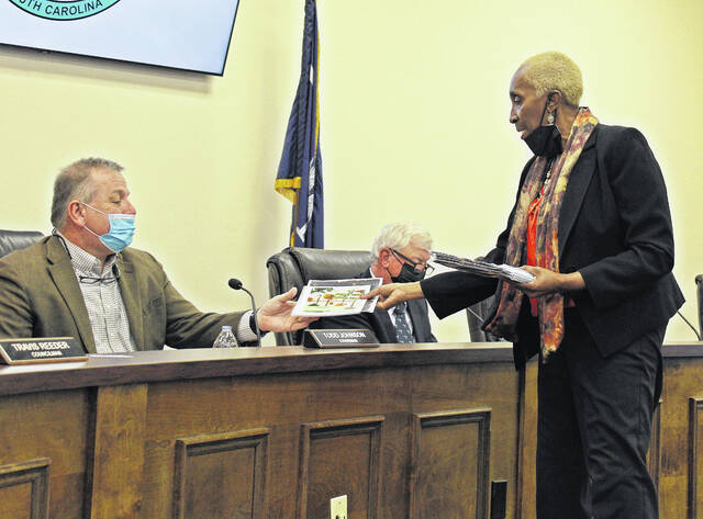 Executive Director of Newberry County Literacy Council, Barbara Chapman (right) provides information to Councilmember Todd Johnson during her presentation to council.
                                 Andrew Wigger | The Newberry Observer
