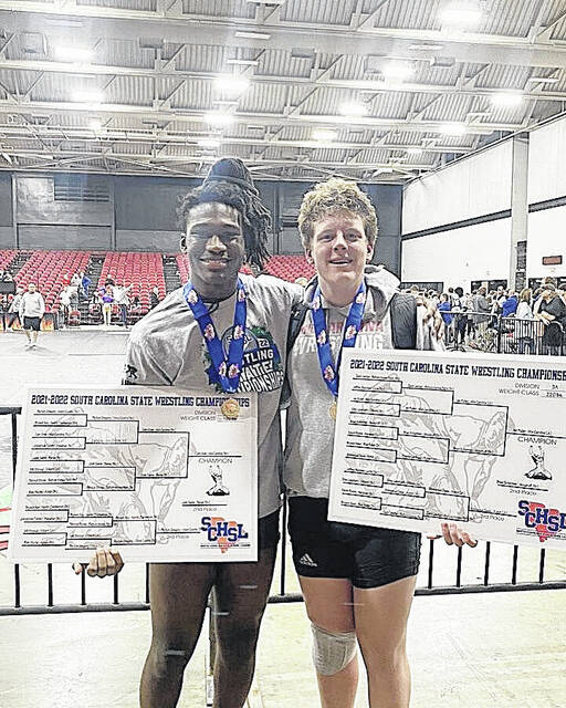 128254131_web1_thumbnail_IMG_4693
Cam Grier (195) and Ian Pullen (220) both won in their respective weight class after competing in the 3A Wrestling State Tournament, held this past weekend.
Courtesy of Mid-Carolina wrestling