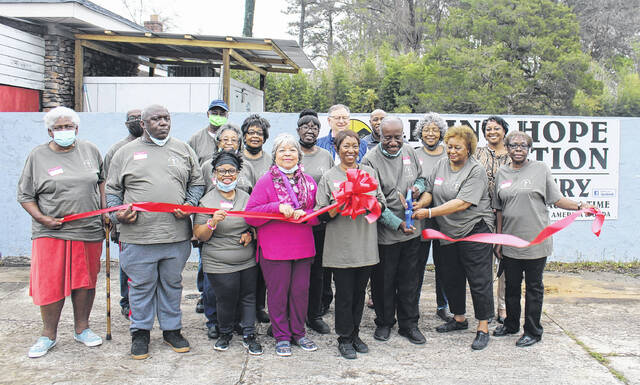 128390721_web1_LHF-Ribbon
John Glasgow, executive director of The Living Hope Foundation, cuts the ribbon at the new food pantry surrounded by volunteers and board members of the foundation.
Andy Husk | The Newberry Observer