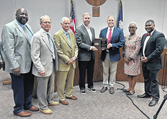 Field Representative Jeff Shacker (center) with the Municipal Association of South Carolina (MASC) was present Tuesday to present Newberry City Council with an award recognizing them as an honoree on the Municipal Elected Officials Institute of Governments Honor Roll.
