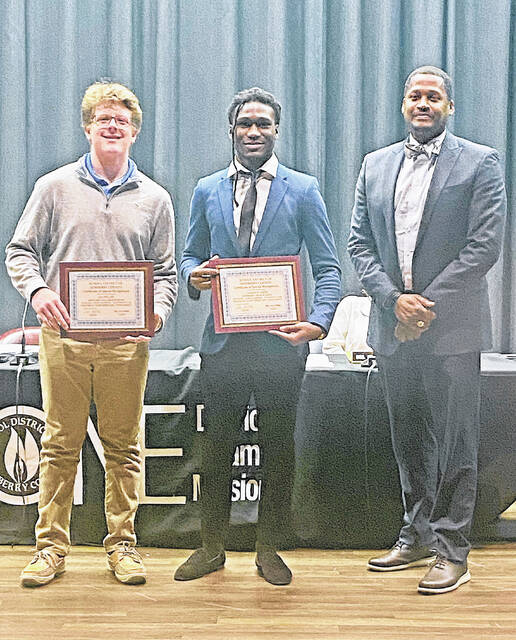 Ian Pullen (left) and Cameron Grier (center) were recognized for their recent state wrestling tournament victories. They are pictured with Superintendent Alvin Pressley.
                                 Courtesy photo