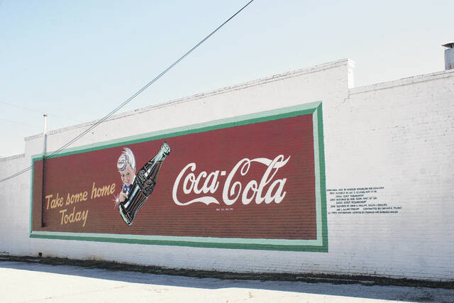 128661656_web1_1110-Harrington--new-mural-paint
One well known example of the The City of Newberrys Downtown Façade Grant Program is the Coca-Cola Mural, located on Harrington Street.
Elyssa Haven for The Newberry Observer