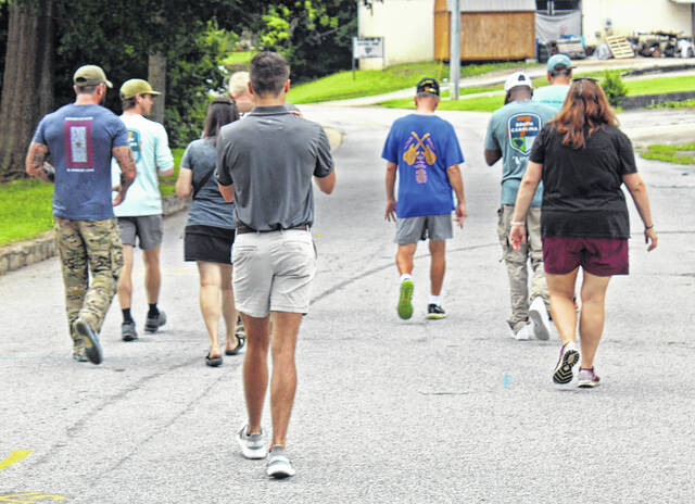 The expedition walks downtown after visiting the Wells Japanese Garden.
                                 Andrew Wigger | The Newberry Observer