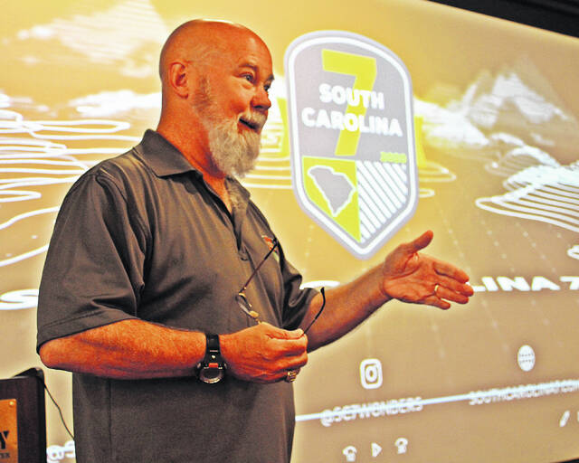 Tom Mullikin speaking after the screening of Higher Ground.
                                 Andrew Wigger | The Newberry Observer