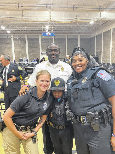 <p>Sergeant Caitlin Branch, Police Chief Kevin Goodman and Corporal Khadijah Caldwell with DJ Daniel.</p>
<p>Courtesy of NPD</p>