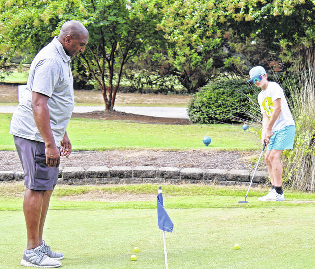 <p>Sinking a 12-footer.</p>
<p>Dylan Francis | The Newberry Observer</p>