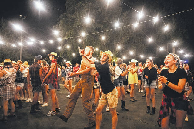 Leaders Sam Worley and Cole Harper, along with Mid-Carolina student, Alli Larsen, during dance through the ages.
                                 Tori Steyne for The Newberry Observer