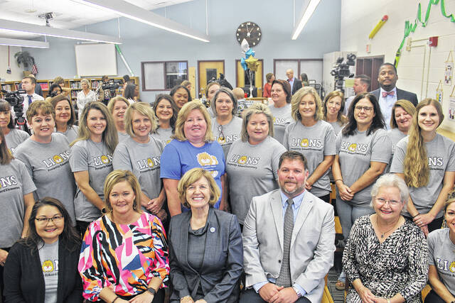 The dedicated staff and faculty with the superintendents following the press conference to reveal the state report card results.
                                 Dylan Francis | The Newberry Observer