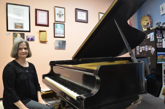 129077408_web1_Neese-20with-20Wise-20piano
Wanda Neese sits at Darr Wises prized piano in her office in the Alumni Music Center.
Courtesy of Newberry College