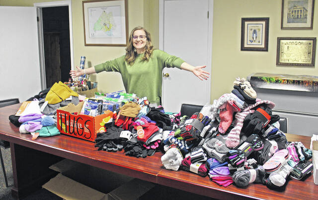 129161817_web1_IMG_0683
Mary Alex Kopp, president-elect of the Newberry County Young Professionals, with the donations collected during this years HUGS Drive.
Andrew Wigger | The Newberry Observer