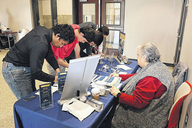 Conference attendees at the Piedmont Technical College table.
                                 Courtesy of Haven Newberry