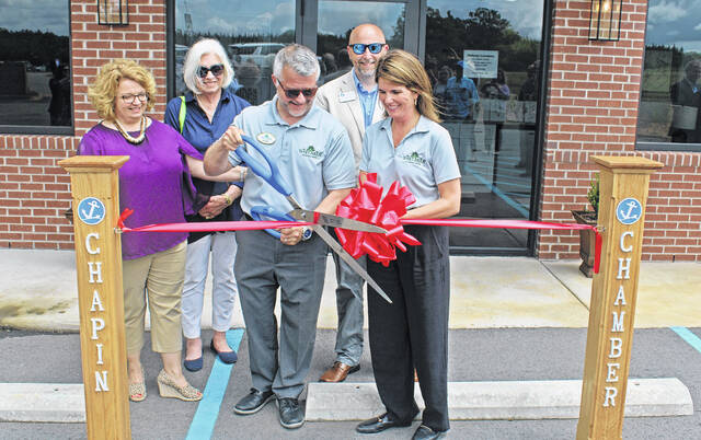 129632726_web1_IMG_1636
Justin Baxley and Erin Whitaker cut the ribbon at their new cremation center, located at Newberry Memorial Gardens. They are pictured with representatives from the Newberry County Chamber of Commerce (Michelle Long and Liz MacDonald) and the Greater Chapin Chamber of Commerce (Paul Sadler).