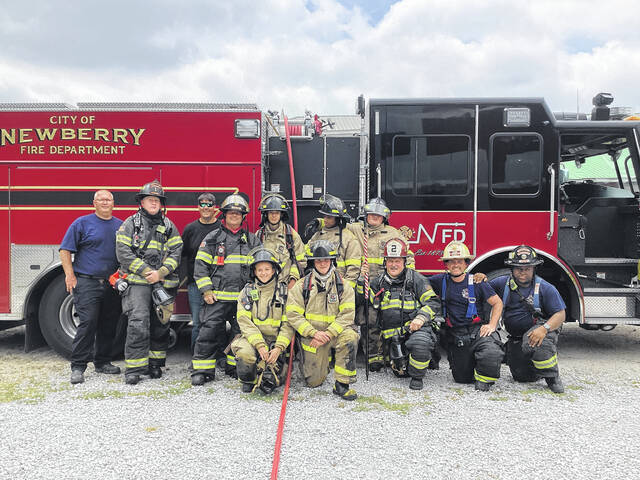 129707751_web1_Career-Center-FF1-group
The Newberry County Career Center Firefighter One students performed their skills test last month at the Newberry County training grounds. The City of Newberry is the host department for the program and assists with training students. All students are also members of the citys junior firefighter program. Pictured are city firefighters and students after their live burn evaluation.
Courtesy photo