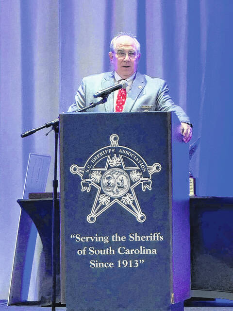 130850345_web1_Sheriff-of-the-Year-2
Sheriff Lee Foster speaks during the 2024 Sheriffs Associations annual conference in July.
Courtesy photos