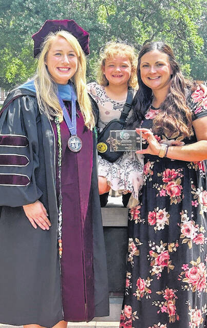 130900044_web1_Jessica-Avery-and-Allie-Turner--2
From left to right: Allie Turner, OTD, OTR/L, academic Fieldwork Coordinator at Presbyterian College; Newtons daughter Avery and Jessica Newton, OTR/L, award recipient.
Courtesy photos