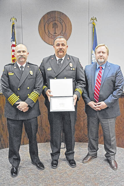 <p>From left to right, Fire Chief Gene Shealy, RJ Dowd and City Manager Jason Taylor.</p>
<p>Courtesy photo</p>