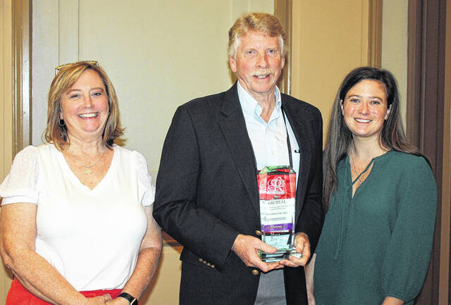 Dr. Michael Bernardo, center, was recently recognized as Physician of the Year by the South Carolina Home Care & Hospice Association. Bernardo has over 30 years of experience taking care of families in Newberry County and has since shifted to geriatric/hospice care in Newberry.
                                 Courtesy photo