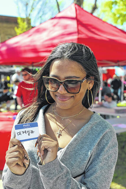 Event visitors had the opportunity to learn and practice writing their name in Korean during this years International Festival.