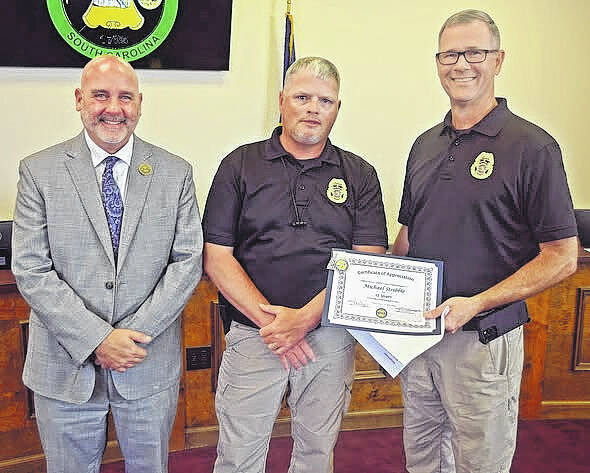 Michael Stribble, center, was recognized by Newberry County Council for 25 years of service with the Newberry County Sheriffs Office.
Courtesy of Newberry County Government