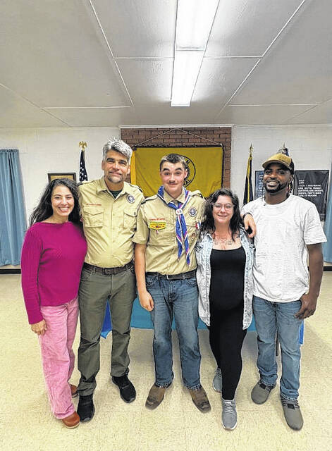 Thomas Logue, center, was recognized for reaching the highest rank of scouting, Eagle Scout, during a ceremony held May 3.
Courtesy photo